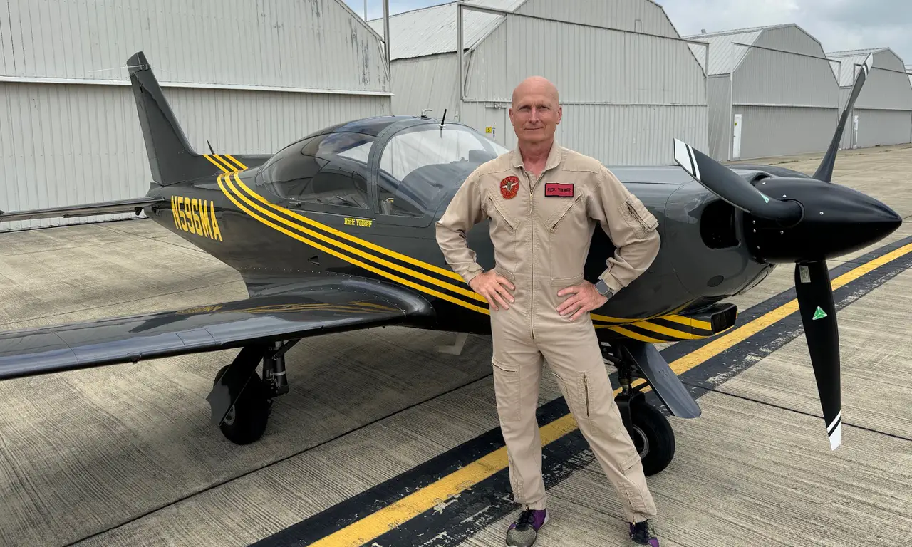 Rick Volker posing in front of SF.260